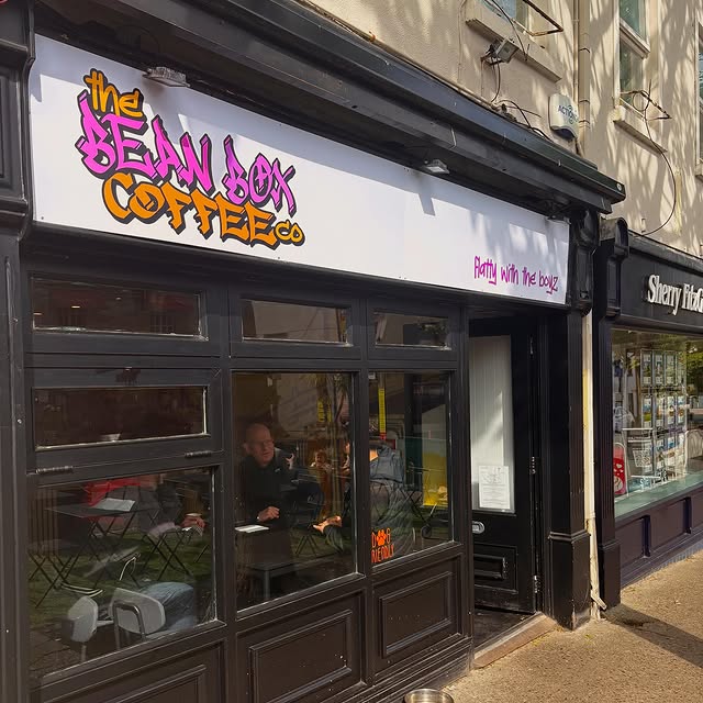Bean Box café exterior with the graffiti sign